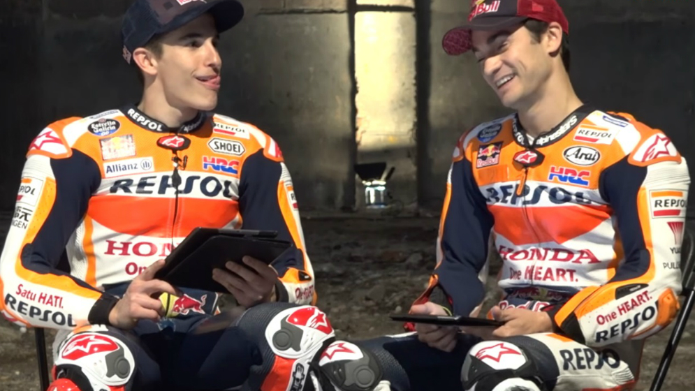 Marquez reaching his nose with his tongue and Dani laughing