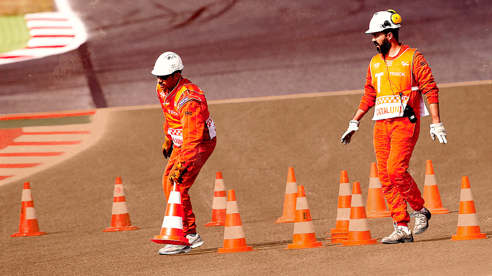 motogp safety: Marshals working in a motogp track